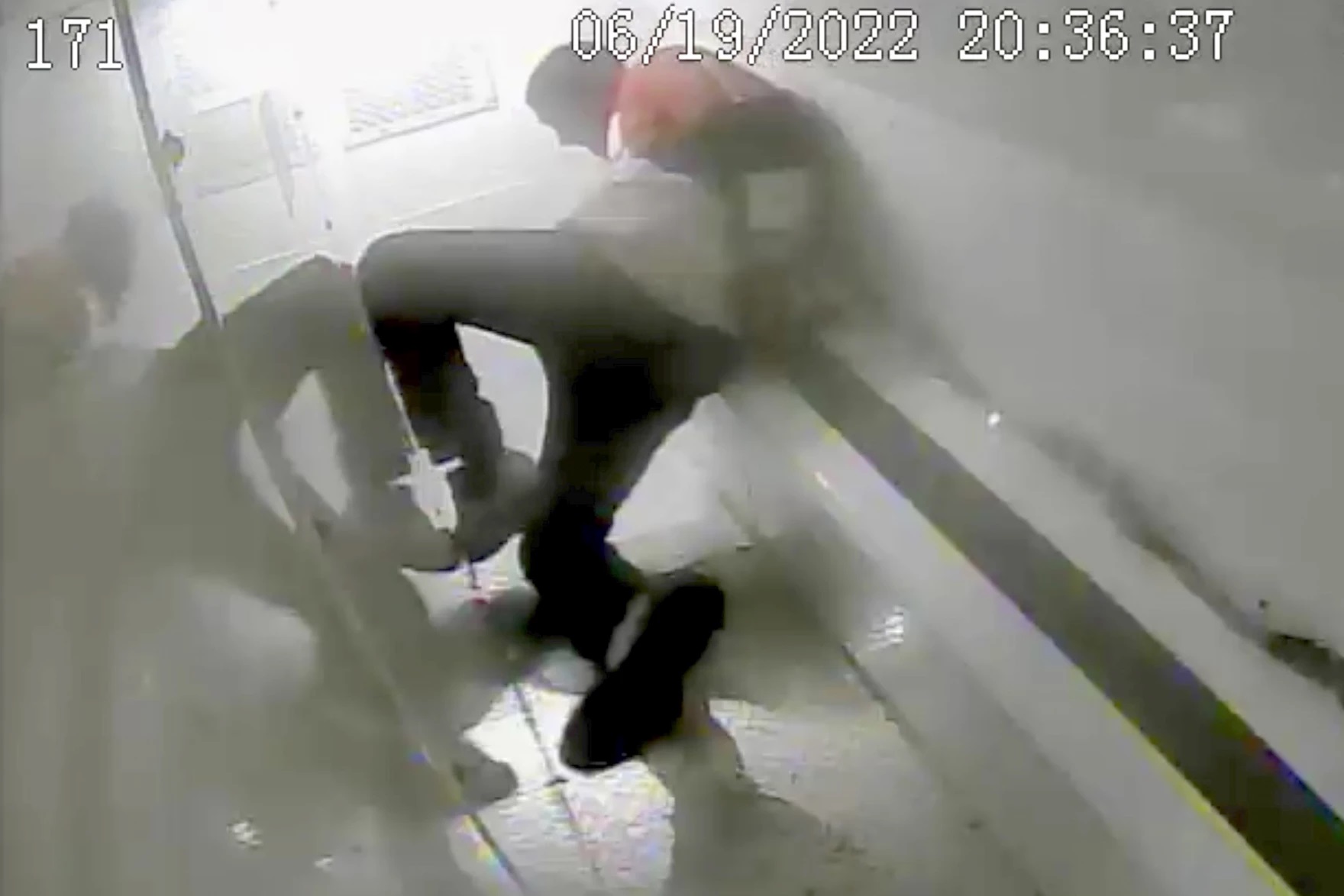 A screenshot from New Haven Police Department video shows handcuffed 36-year-old Richard Randy Cox